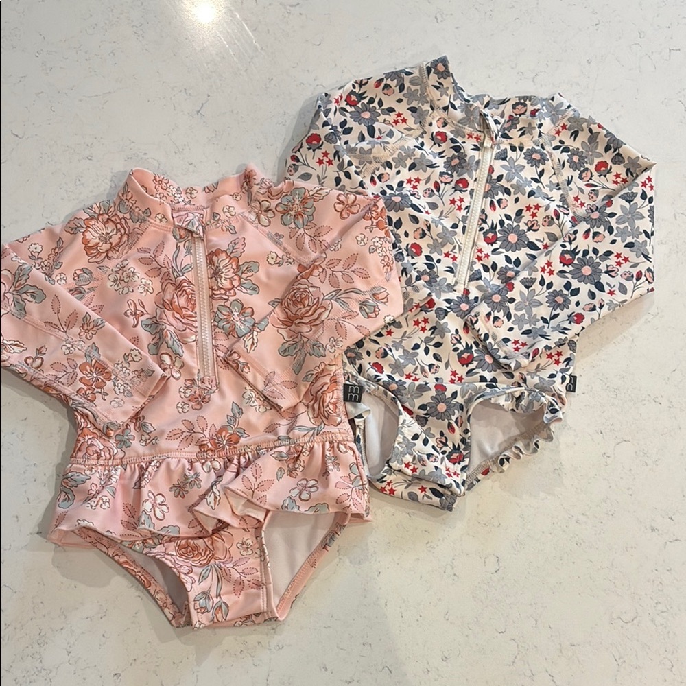Modern Moments (2) long sleeve floral swim suits. Size 6-9M